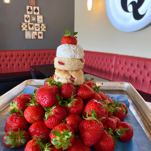 Pile of strawberries and scones for Strawberry Social Tea at Queen of Hearts Tea House Kitchener